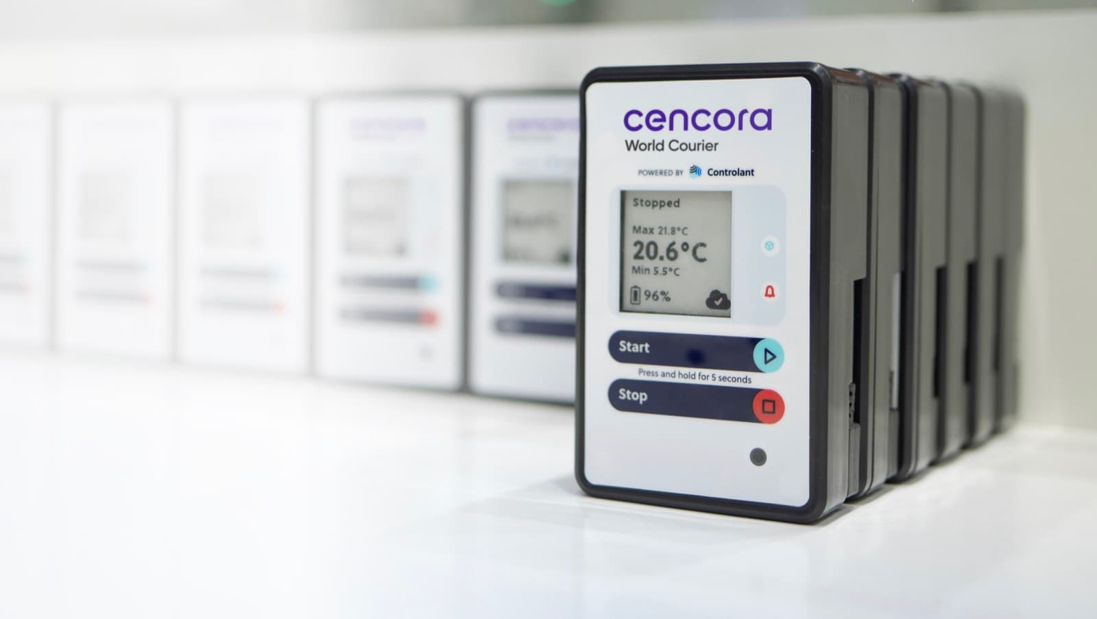 A row of Cencora World Courier devices powered by Controlant on a white surface, the nearest reading 20.6 °C